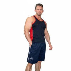 May include: A black and red athletic tank top with a small logo on the chest, paired with navy blue athletic shorts. The shorts have a white stripe down the side and a logo near the hem. The outfit is designed for athletic activities.