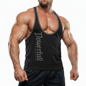 May include: Black athletic tank top with gray trim and the word "Powerful" printed vertically in a stylized font. The tank top is sleeveless with a racerback design. The text "fath sport international" is printed below the word "Powerful".