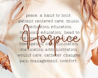 May include: Cream-colored t-shirt with the word "Hospice" in a cursive font. The shirt features a list of hospice care services in a black font. The model is wearing blue jeans.