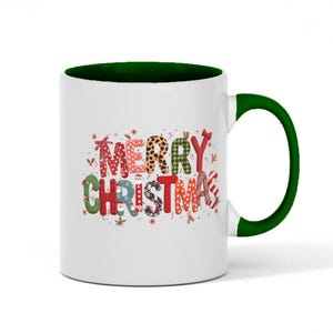 May include: White ceramic mug with a green handle and interior. The mug features the words "MERRY CHRISTMAS" in colorful, patterned letters. The patterns include leopard print, plaid, and stripes, with small decorative elements.