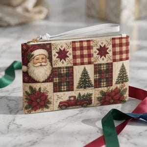 May include: A rectangular wristlet pouch featuring a patchwork-style print with Christmas imagery including a Santa Claus face, red and white buffalo plaid squares, green pine trees, red poinsettia flowers, and a red pickup truck carrying a tree.