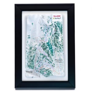 May include: Framed map of Telluride ski resort, featuring a detailed layout of ski runs and lifts. The map is in shades of green, white, and blue, set against a textured background. The black frame adds a classic touch to this piece of wall art.