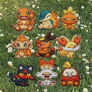 May include: Nine embroidered patches featuring various colorful cartoon characters, including a red and orange dragon-like creature, a blue and yellow hedgehog-like character, and a white rabbit-like character. The patches are set on a green grassy background with small white flowers.