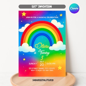 May include: A colorful 5x7 inch invitation with a rainbow, clouds, and stars. The text reads "Join us for a magical celebration." It announces "Olivia is turning 3" with the date and time. The Canva logo is in the upper right corner.