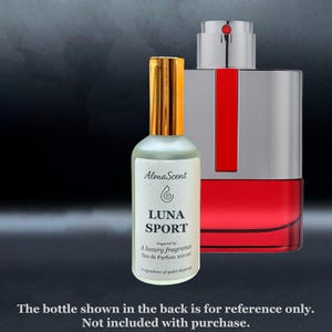 May include: A perfume bottle with a gold cap and a white label featuring the text "LUNA SPORT". The bottle is filled with a light green liquid. The label also includes the text "Eau de Parfum 100 ml". A larger perfume bottle is in the background.