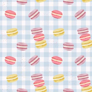 May include: Watercolor pattern of colorful macarons in pink, yellow, and purple, arranged on a light blue and white checkered background. The macarons are stacked and scattered, creating a sweet and whimsical design.