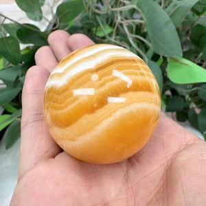 Natural Orange Calcite Sphere 2.5–3in | Polished Crystal Ball for Energy Healing & Decor