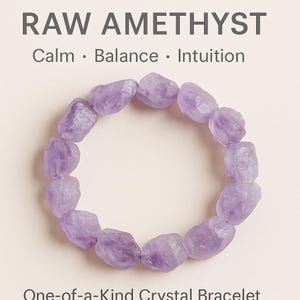 May include: A raw amethyst bracelet composed of light purple, irregularly shaped stones. The text "RAW AMETHYST" is at the top, with "Calm • Balance • Intuition" below it. The words "One-of-a-Kind Crystal Bracelet" are at the bottom.