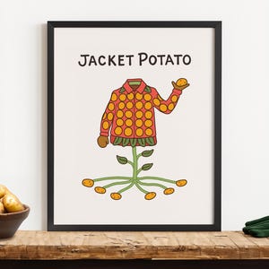 Könnte beinhalten: Ein gerahmter Kunstdruck mit einer skurrilen Illustration einer Ofenkartoffel. Das Kunstwerk zeigt eine Jacke mit orangefarbenen Kreisen, eine grüne Blattbasis und Kartoffeln. Der Text "JACKET POTATO" steht oben.