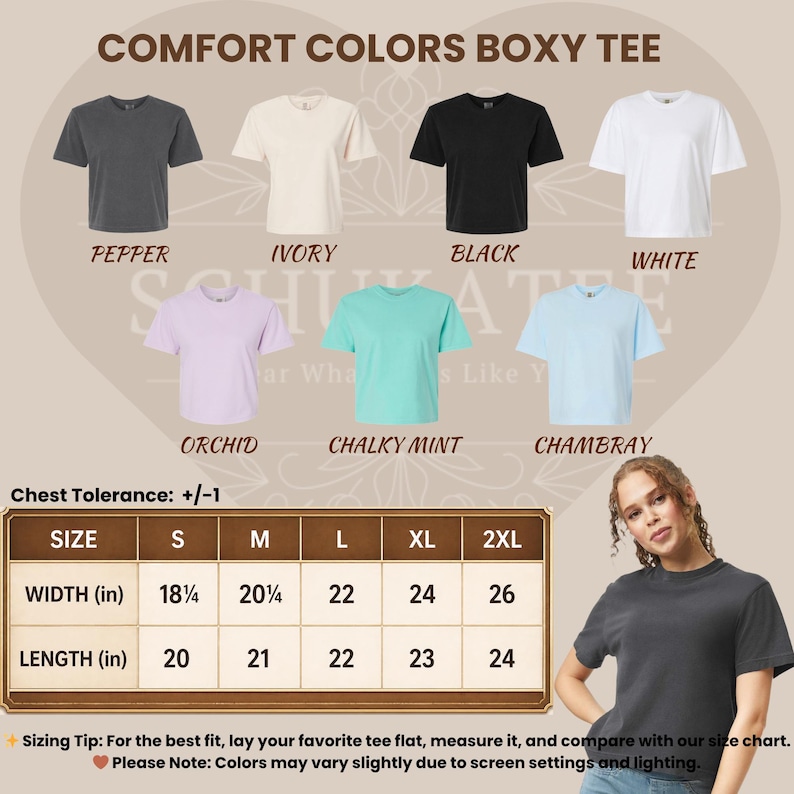 May include: A display of Comfort Colors boxy tees in various colors, including pepper, ivory, black, white, orchid, chalky mint, and chambray. A size chart shows chest width and length in inches. The text reads "Comfort Colors Boxy Tee."