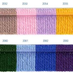 May include: A color chart with 16 yarn samples. The samples are arranged in two rows of eight. The top row includes white, beige, pink, lavender, yellow, orange, red, and burgundy. The bottom row includes gray, brown, green, light blue, blue, purple, navy, and black.