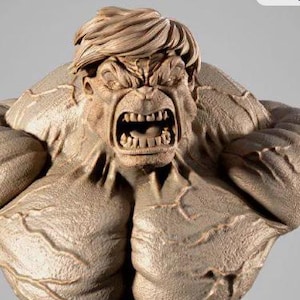 May include: A detailed bust of the Hulk, featuring a highly detailed face with an open mouth, showing teeth. The sculpture is in shades of brown and tan, with prominent muscle definition. The base appears to be a destroyed structure.