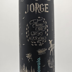 May include: Black insulated water bottle with silver etched designs and the name "Jorge". Features include the text "I solemnly swear that I am up to no good" and other graphics. The bottle has the brand name "owala."