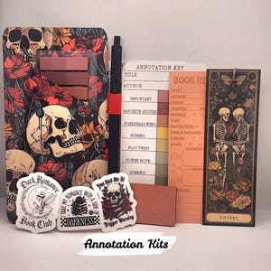May include: A book annotation kit featuring a skull and floral patterned sticky note holder, a black pen, an annotation key card, a book review card, a bookmark with two skeletons, and three stickers with text including Dark Romance Book Club.