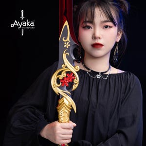 May include: A decorative sword with a red blade and gold accents. The sword features a floral design with red flowers and the text "Ayaka BladeStudio" in white.