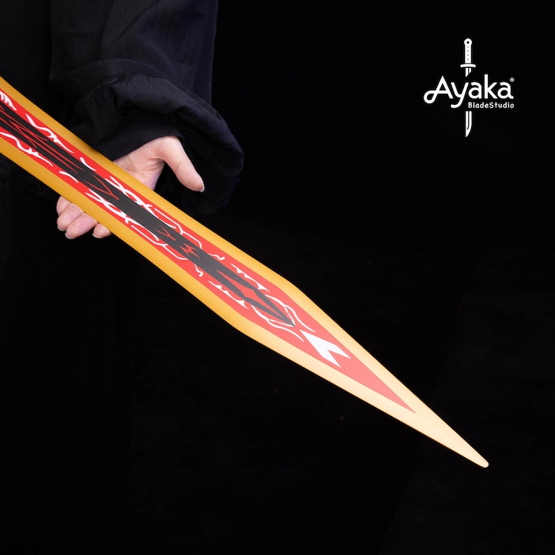 May include: A decorative sword with a yellow blade featuring red and black geometric designs. The sword's tip is pointed, and the handle is not visible. The image is set against a black background.