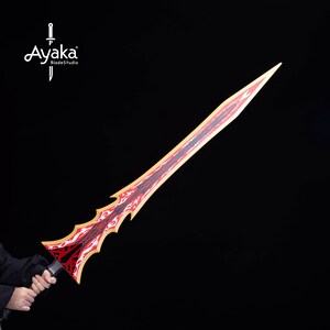 May include: A red and gold sword with a flame design. The sword has a black handle and the text "Ayaka BladeStudio" in white. The sword is held against a black background.