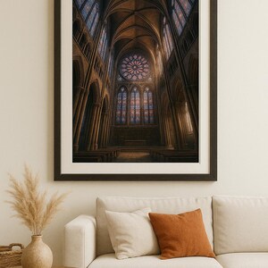 May include: Framed print of a cathedral interior. The artwork depicts a high-ceilinged space with arched columns, stained glass windows, and a rose window. The color palette is dominated by warm browns and blues, creating a sense of depth and grandeur.