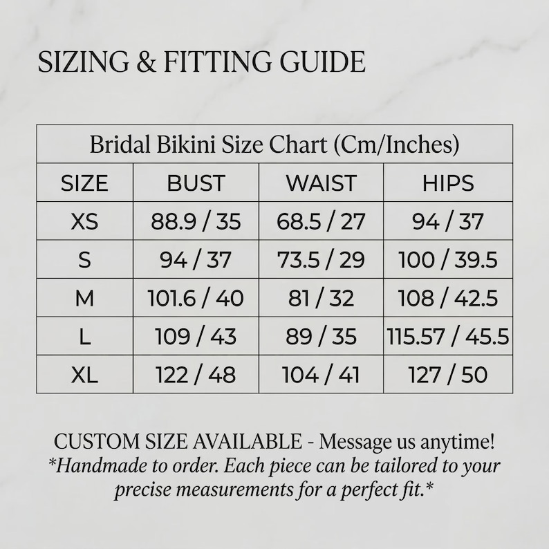 May include: A black and white sizing and fitting guide for a bridal bikini. The chart lists sizes XS through XL with corresponding bust, waist, and hip measurements in both centimeters and inches. Text at the bottom notes custom sizing is available.