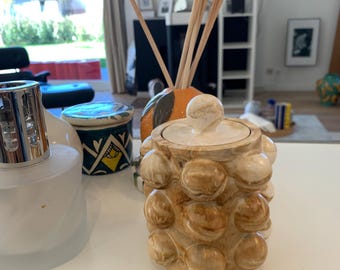 candle with decorative resin jar with lid