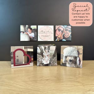 May include: A collection of custom photo magnets and blocks. The magnets display various images, including a child in a car, a couple, and a logo that says "Magnetic Personalities". The blocks feature photos of a girl, a building, and a dog wearing a hat.