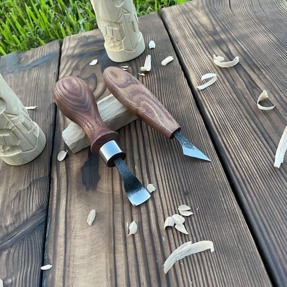 A matched set of hand-forged 52100 steel chip carving knives with ash handles — a proper toolkit for the woodworker who takes their craft seriously.