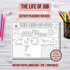May include: Black and white activity placemat for kids with the text "THE LIFE OF JOB" and "ACTIVITY PLACEMAT FOR KIDS". Includes a word search, matching, and maze activities. Colored pencils are in a black mesh cup and scattered on a light wood surface.