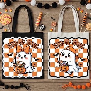 May include: Two Halloween-themed tote bags. One black, one white. Each features a cartoon ghost with a pumpkin basket, the words "Trick or Treat", and a checkered orange and white background. Candy and decorations surround the bags.