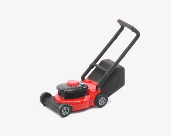 tiny toy lawn mower