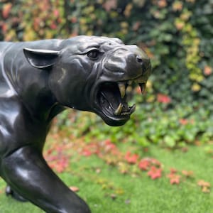 Bronze Panther Sculpture: Lifelike Garden Decor, Elegant Collectible