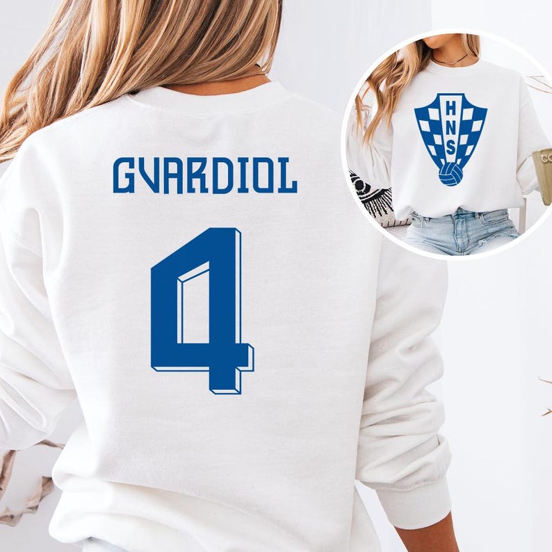 A white sweatshirt with the name 'GVARDIOL' and the number '4' printed on it.