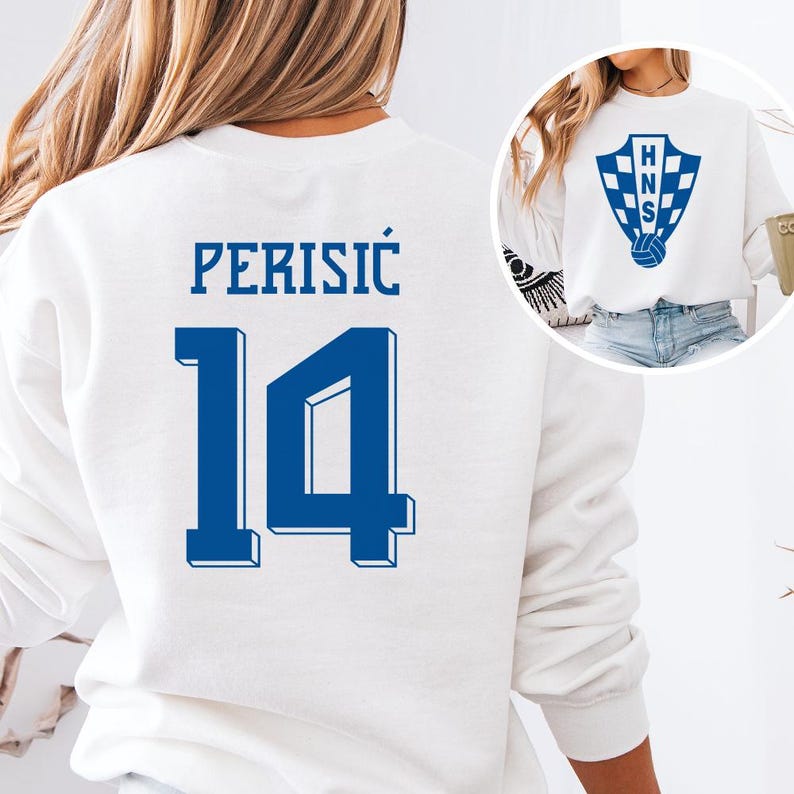 A white sweatshirt with the number 14 printed on it, along with a logo.