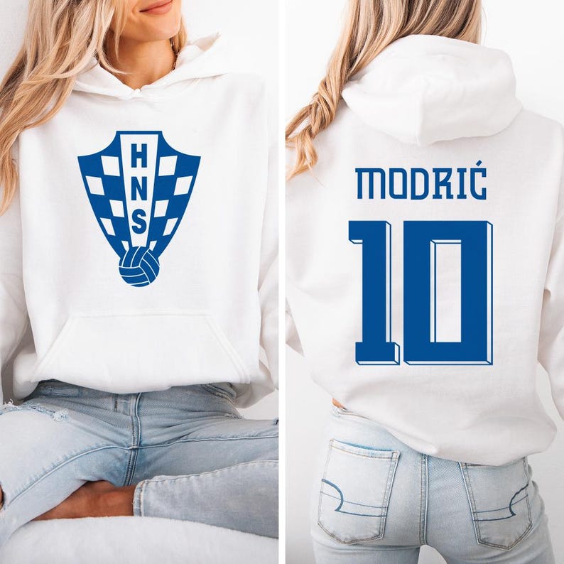 A white hoodie with a blue logo and the number 10 on the back, along with the name 'MODRIC' and the number '10'.