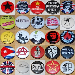 May include: A collection of 24 round button badges with various designs and slogans. The badges feature a variety of themes, including punk rock, political activism, and social commentary. Some of the slogans include "No Future", "Free Pussy Riot", "We Are The 99%", and "Stiff Little Fingers".