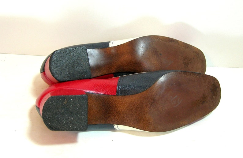 red and white spectator pumps