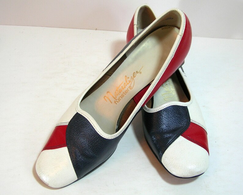 red and white spectator pumps