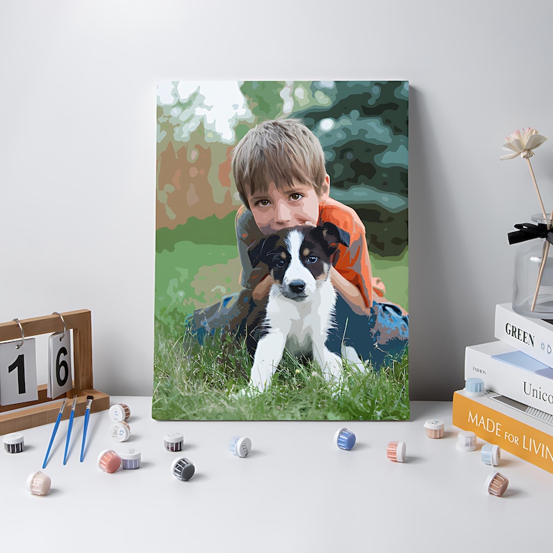 May include: A paint-by-numbers canvas featuring a stylized illustration of a young person with brown hair wearing an orange shirt, embracing a black and white puppy in a grassy field. The artwork uses distinct color blocks to define the subjects.