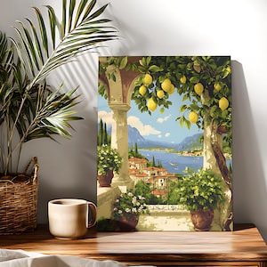 May include: A framed canvas print showing an Italian coastal scene. The artwork features a terrace with potted plants, a lemon tree, and a view of a lake and mountains. The colour palette includes blues, greens, yellows, and browns.