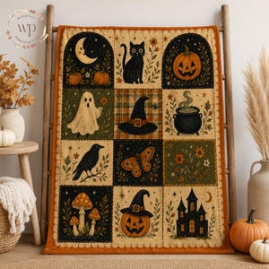 May include: A rectangular throw blanket featuring a grid of twelve illustrated panels with Halloween themes, including a black cat, a ghost, a jack-o'-lantern, a witch hat, a cauldron, a raven, a moth, mushrooms, and a haunted house on a cream background.
