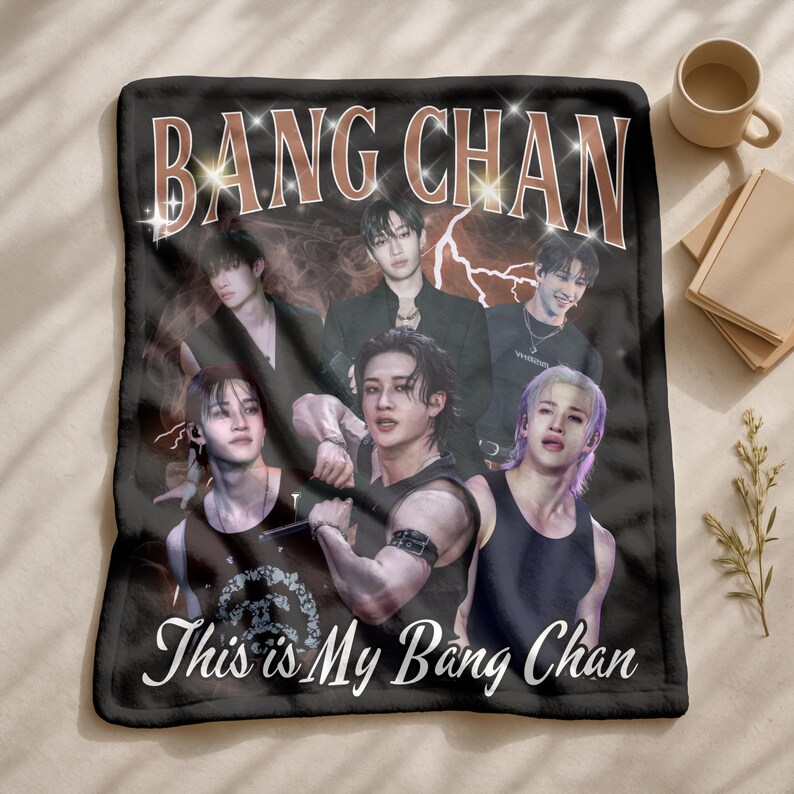 May include: Black fleece blanket with a group of six people and the text "BANG CHAN" in a retro style font. The blanket also has the text "This is My Bang Chan" in a white script font.
