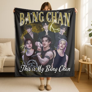 May include: Black blanket with a gold "BANG CHAN" text and a group of six people. The blanket also has the text "This is My Bang Chan" in white script. The background features yellow lightning bolt designs.