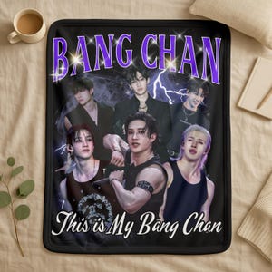 May include: Black blanket with a group of people and the text "BANG CHAN" in purple, and "This is My Bang Chan" in white. The blanket has a black border and a soft appearance.