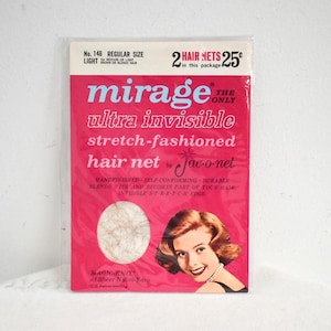 May include: Vintage package of "mirage" hair nets. The package is pink with the words "mirage ultra invisible stretch-fashioned hair net" in white and blue. It features an image of a woman with red hair and a hair net sample.