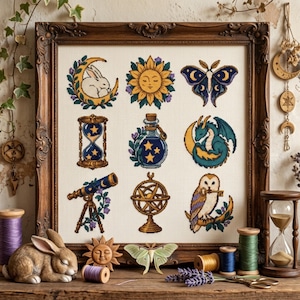 May include: A framed cross-stitch sampler featuring a grid of nine embroidered icons: a rabbit on a crescent moon, a sun face, a moth, an hourglass, a potion bottle, a dragon, a telescope, an armillary sphere, and an owl holding a key.