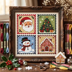 May include: A framed cross-stitch embroidery featuring four square panels with Christmas themes: a Santa Claus face, a decorated Christmas tree, a snowman, and a gingerbread house. The piece is surrounded by embroidery floss, holly, and scissors.