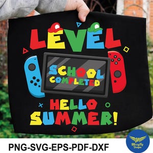 May include: Black tote bag with vibrant text and graphics. The design features the words "LEVEL," "SCHOOL COMPLETED," and "HELLO SUMMER!" alongside controller graphics. The bag also includes the text "PNG-SVG-EPS-PDF-DXF."