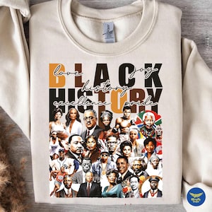 May include: Cream-coloured sweatshirt with a collage of portraits of notable Black figures. The words "love, joy, history, excellence, pride" are printed in black, brown, and orange. The sweatshirt has a crew neck.