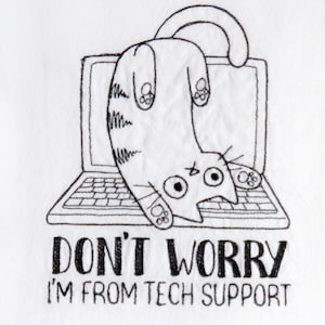 May include: An embroidered design on white fabric. It depicts a cartoon cat hanging upside down from a laptop. Below the laptop, the text reads "DON'T WORRY I'M FROM TECH SUPPORT" in black. The design is in black and white.