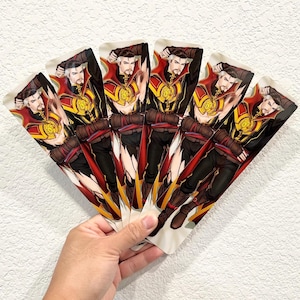 May include: A set of five rectangular bookmarks featuring a digital illustration of a male character with a goatee, wearing a high-collared red and gold cloak, a dark tunic, and brown gloves, arranged in a fan shape against a white background.