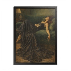 May include: A framed painting shows a woman in a black dress resting on a green sofa, holding a book. The artwork is in a classical style with soft lighting and a muted colour palette, creating a calm and reflective atmosphere.